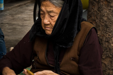 Old woman counting cash